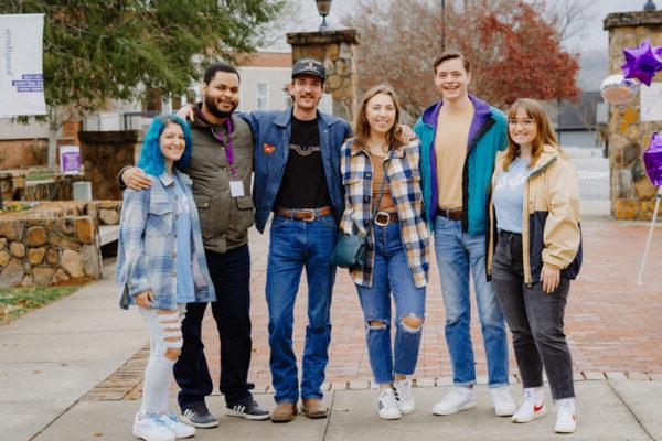 a group of people posing for a photo